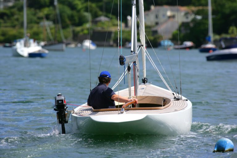 Rustler 24 sailing with side-mounted outboard